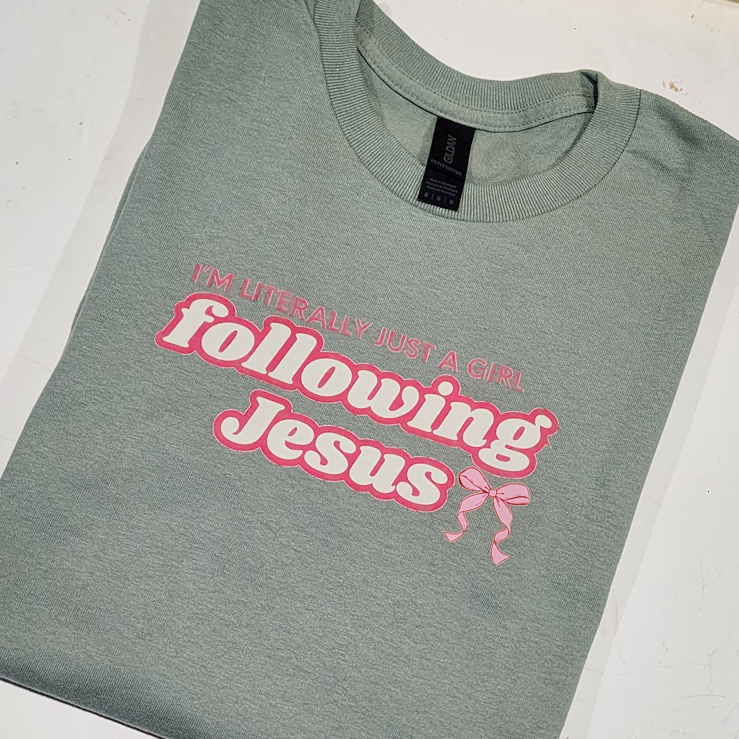 Mint Green t-shirt with pink text and graphics on a white background